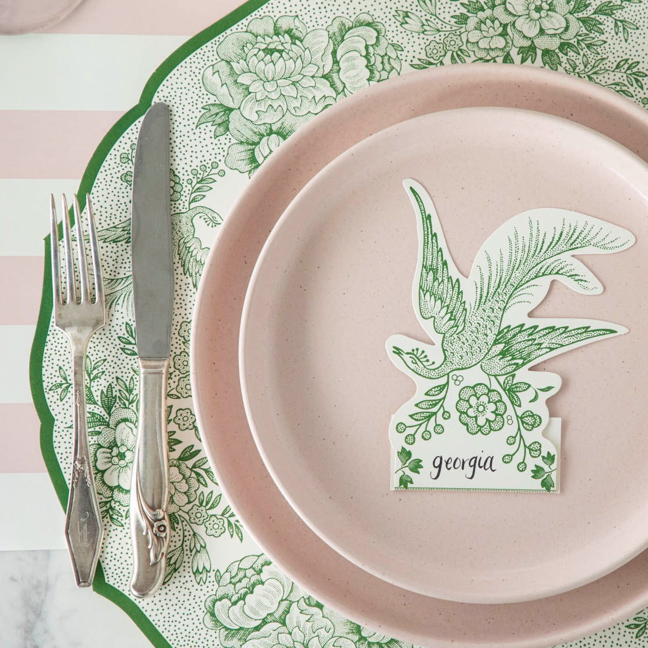 Close-up of the Die-cut Green Asiatic Pheasants Placemat in an elegant place setting, showing the artwork in detail.