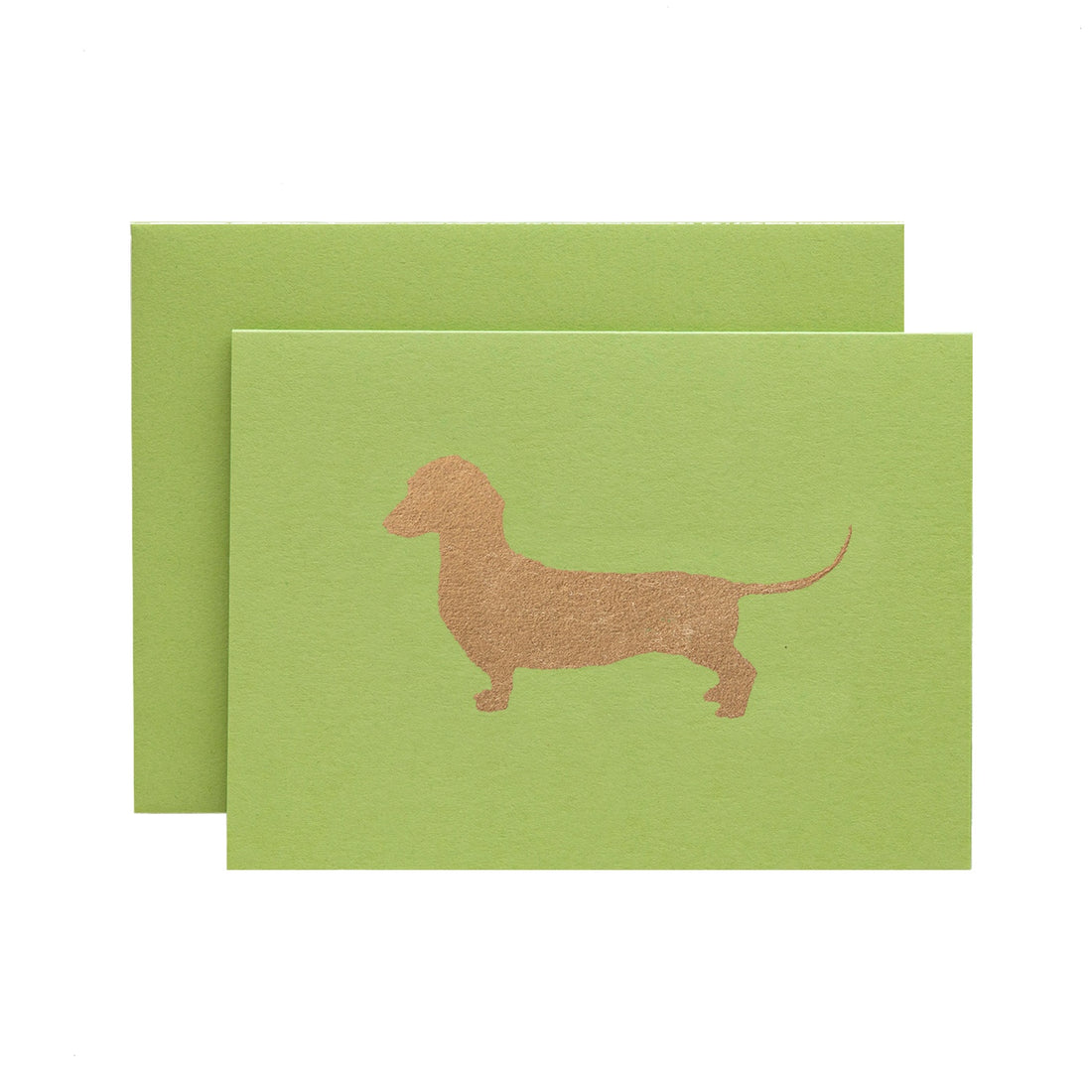A lime green card featuring the silhouette of a dachshund in solid gold leaf.
