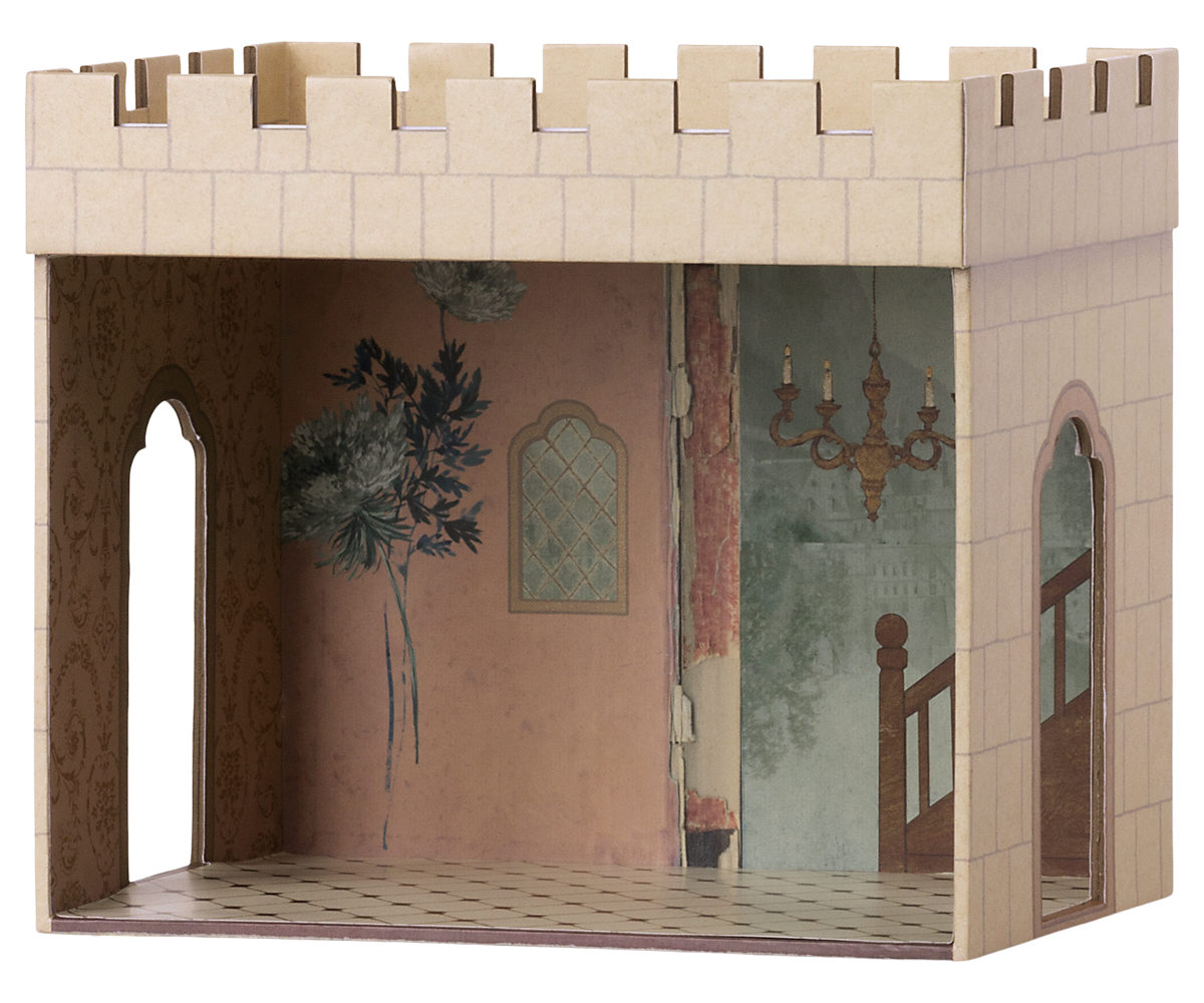 Model of a castle with detailed interior design on a white background.