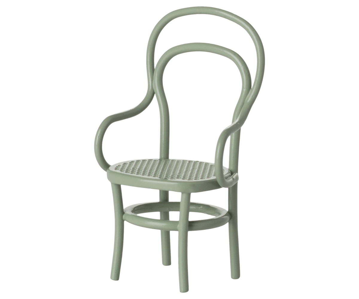 Light green chair with a woven seat on a white background.