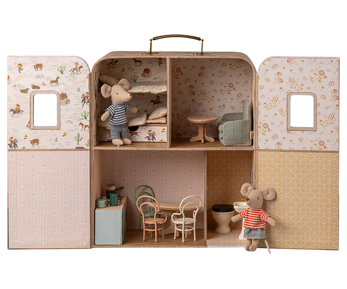 Miniature dollhouse with furniture and toy mice inside a suitcase