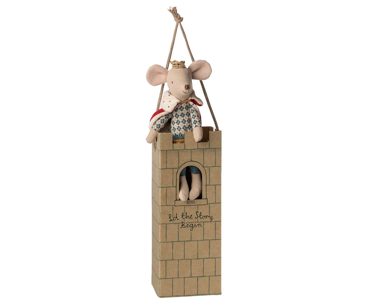 Stuffed mouse in a small tower with a white background.