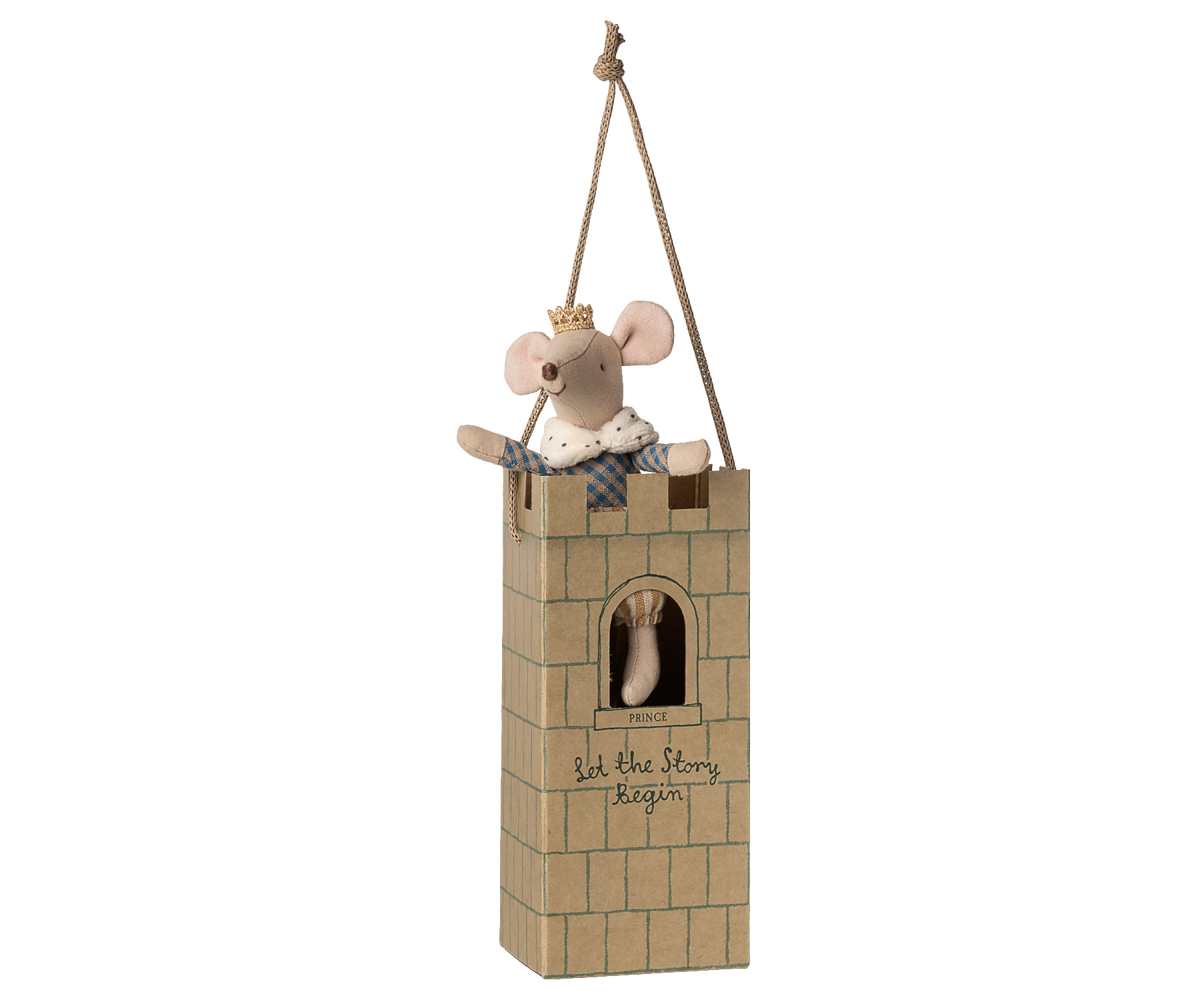 Stuffed mouse in a small castle box on a white background.