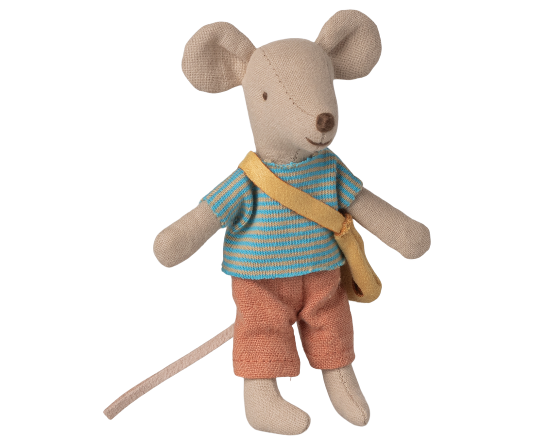 Stuffed toy mouse wearing a striped shirt and brown pants on a white background