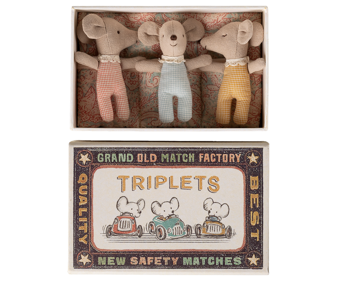 Three toy mice in a matchbox with a vintage-style label.