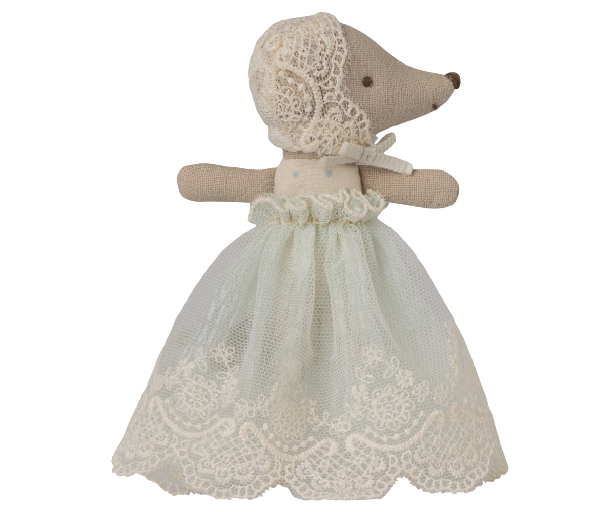 Stuffed animal toy with a lace dress on a white background