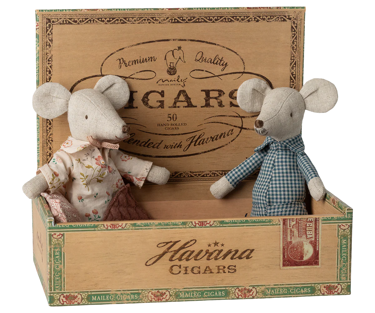 Two toy mice in a decorative cigar box with &