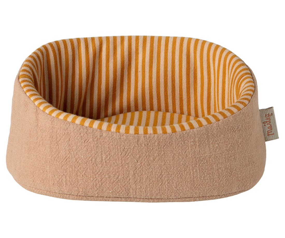 Round pet bed with striped interior on a white background