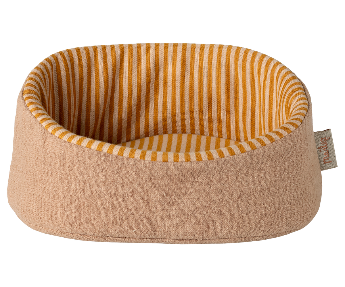 Round pet bed with striped interior on a white background