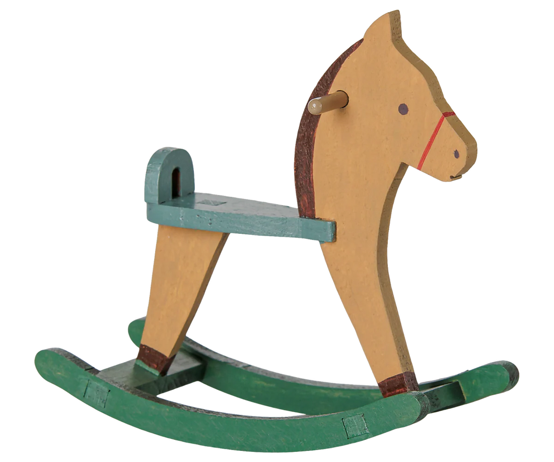A classic wooden rocking horse toy with a natural wood body, painted green rocking base, and a teal seat and backrest.