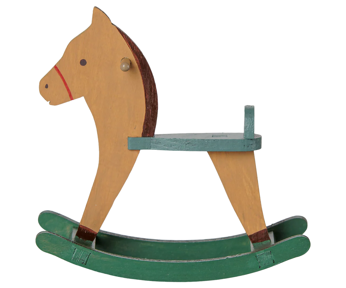 A traditional wooden rocking horse toy with a natural wood body, a teal painted seat, and green rocking base, isolated on a white background.