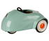 A retro-style miniature toy car in a glossy mint green finish, featuring a black steering wheel, black tires, and white-walled tires with orange center caps, shown on a plain white background.
