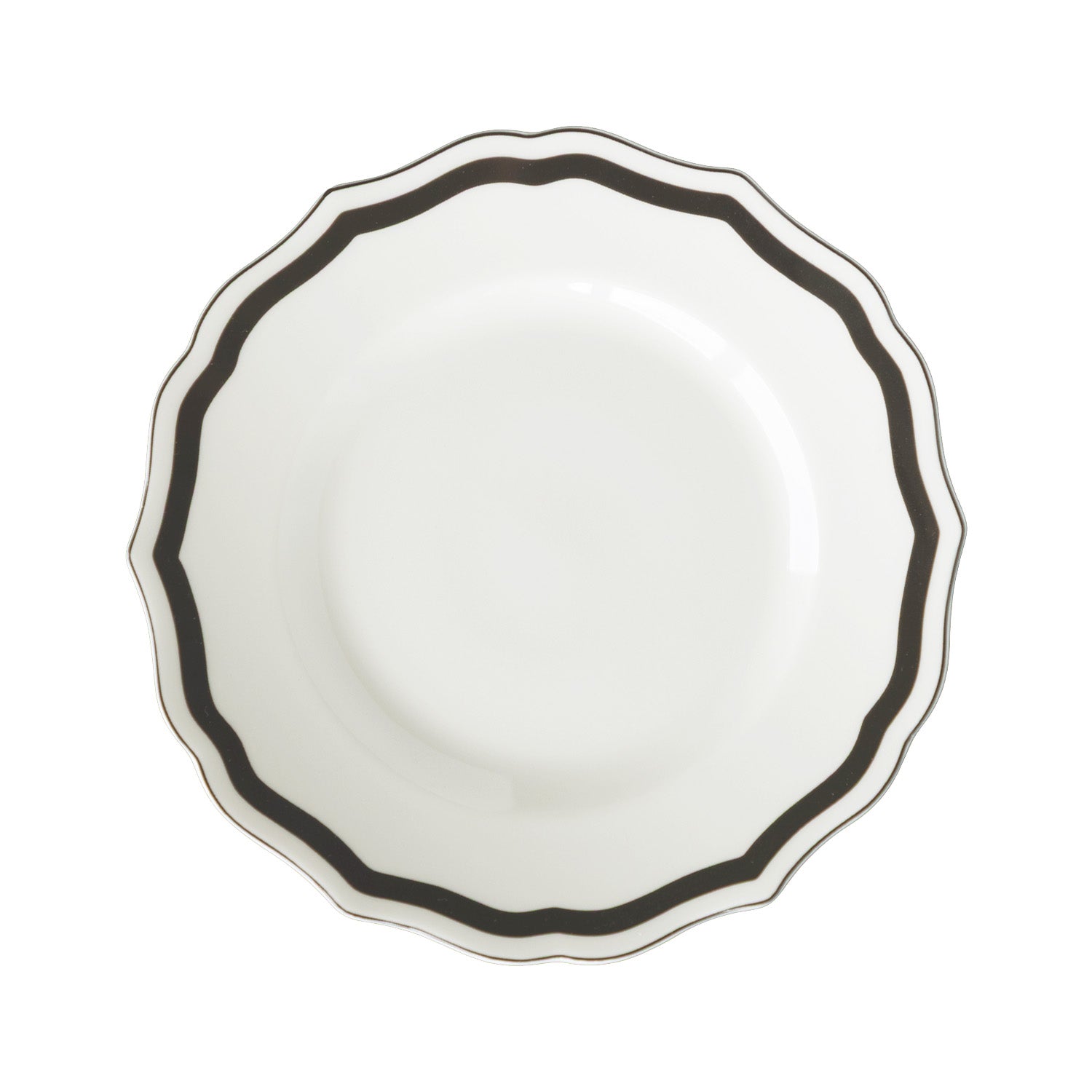 Round white salad plate with a black rim and scalloped edge on a white background.
