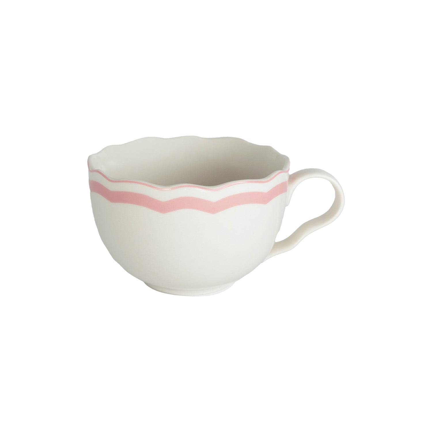 White mug with a pink scalloped rim on a white background.