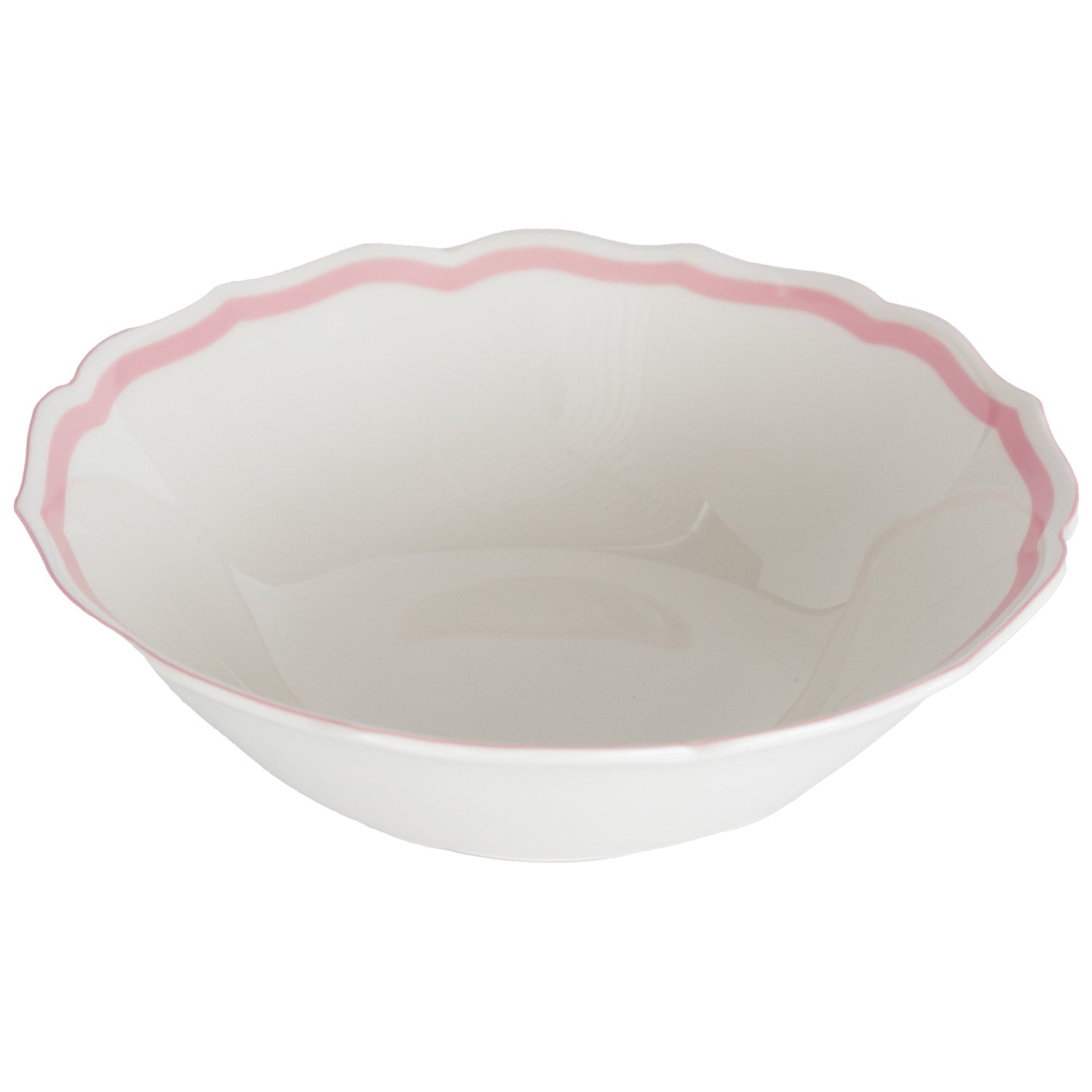 Round white serving bowl with a pink scalloped rim on a white background.