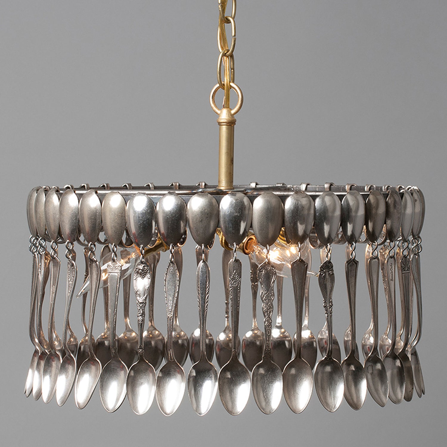 A hand-crafted Spoon Pendant Light made of vintage spoons hanging from a chain by Hester &amp; Cook.