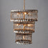 Triple Tier Spoondelier, a chandelier made of silver spoons, on a gray background, made by Hester & Cook.