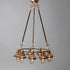 Antique bronze chandelier with multiple glass lampshades and antique insulators suspended from the ceiling, made in the USA by Hester & Cook&