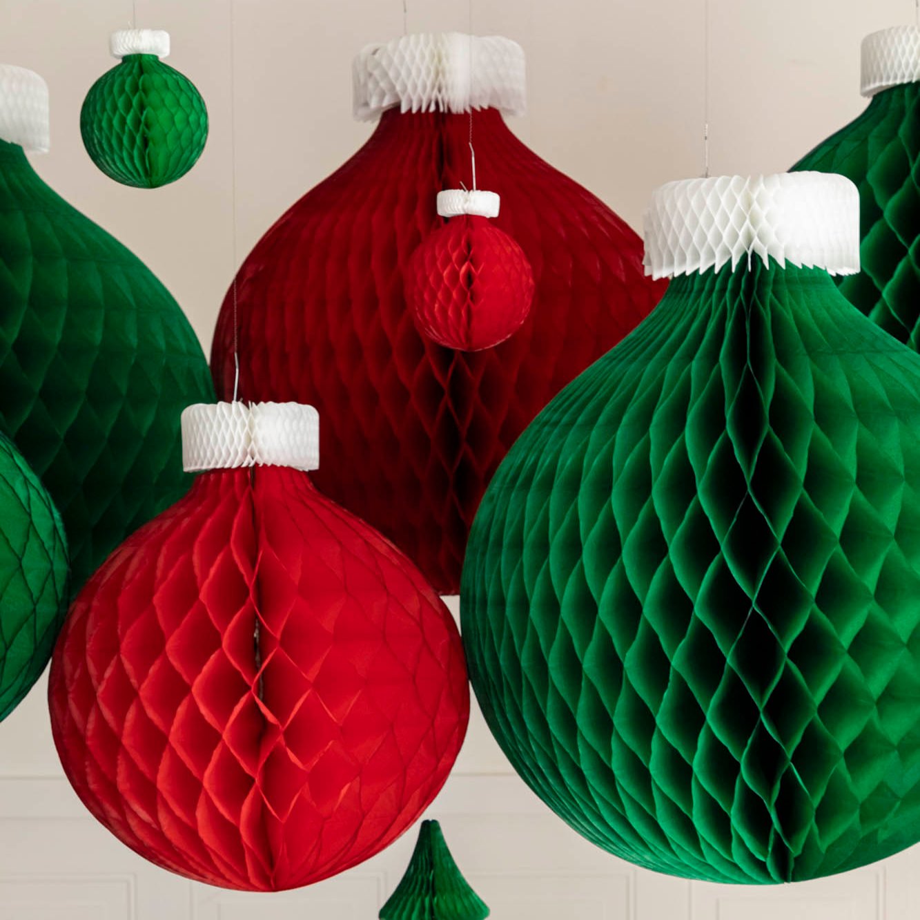 Various sized Honeycomb Classic Ornaments hanging from the ceiling.