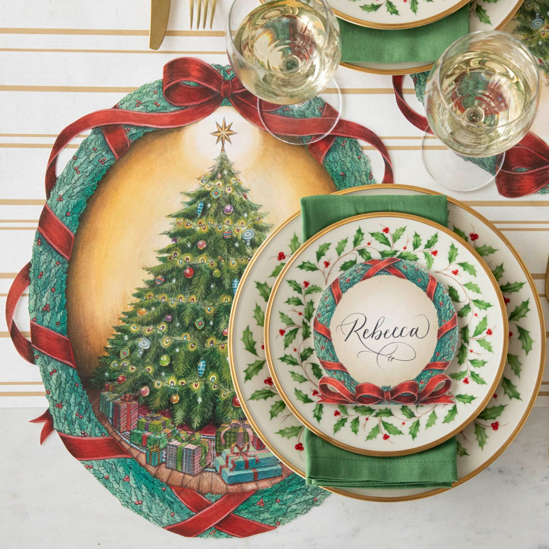 Die-cut O Christmas Tree Wreath Placemat with holly themed dinner plates fancy table setting.