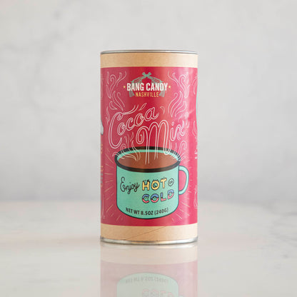 A tin with a cup of coffee on it, filled with Hester &amp; Cook Original Bang Candy Hot Cocoa Mix.