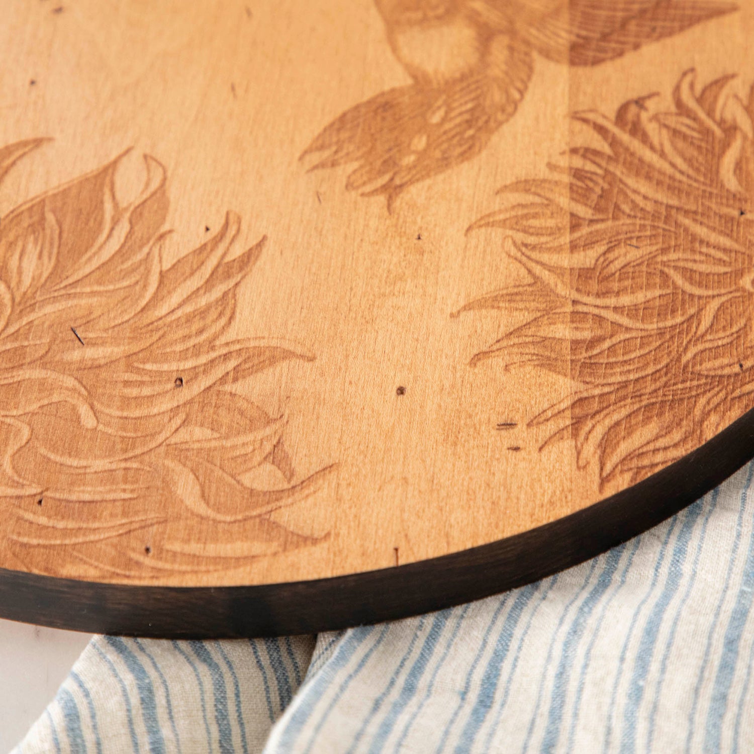 A JK Adams Hummingbird Maple Artisan Round Charcuterie Board.