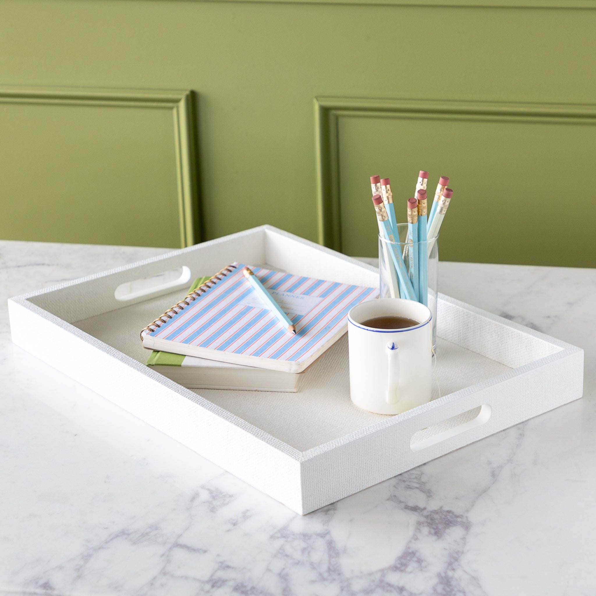 Silk Linen St. Tropez Decorative Tray with a book, planner, cup of tea and cup of pencils atop.