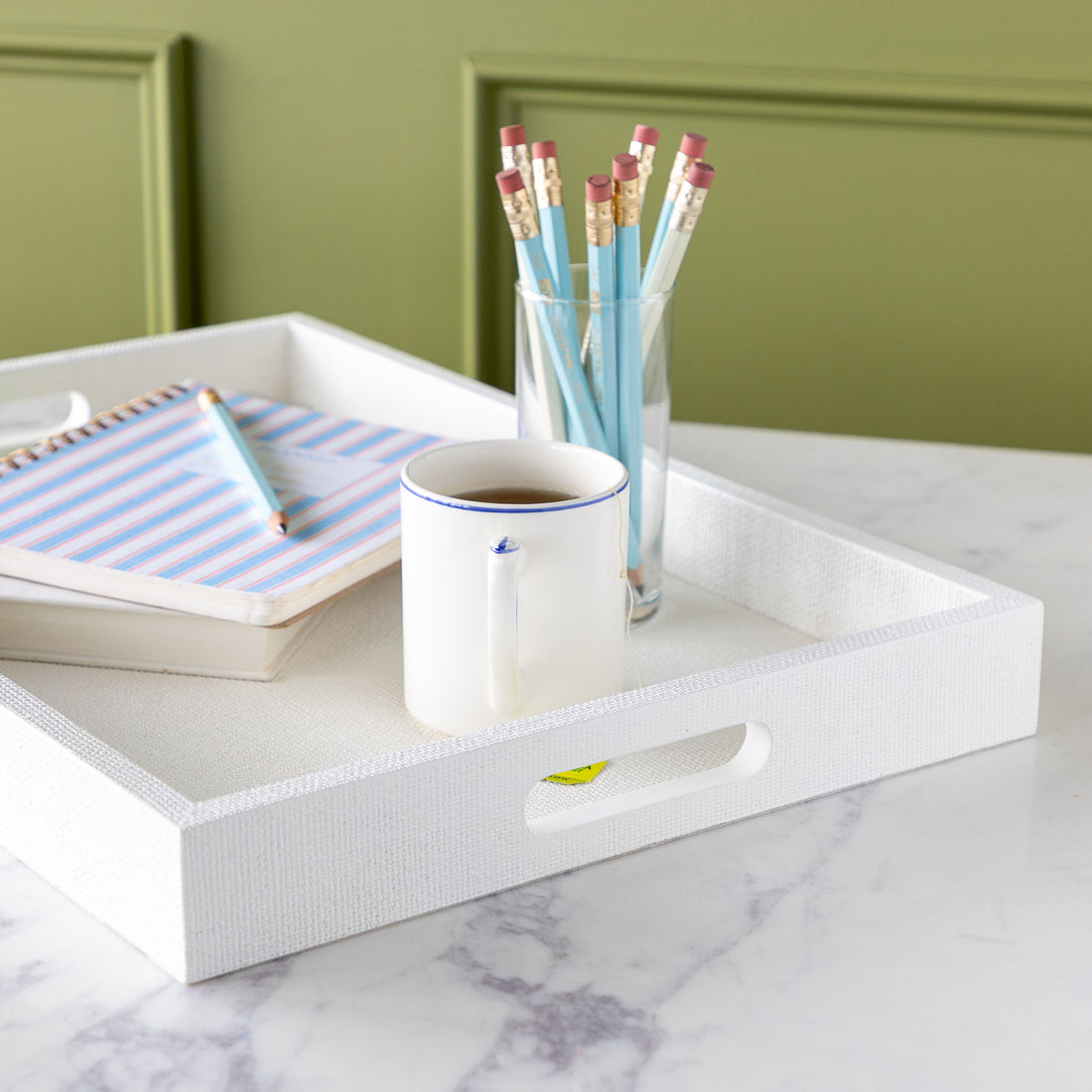 Silk Linen St. Tropez Decorative Tray with a book, planner, cup of tea and cup of pencils atop.