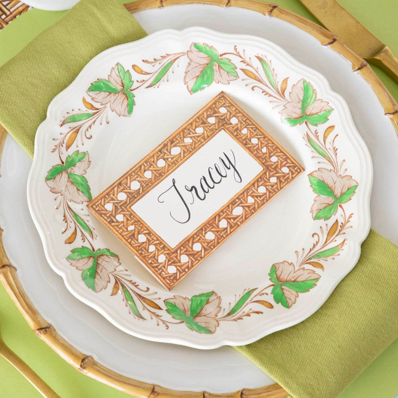 Rattan Weave Place Card with &quot;Tracey&quot; written on it, on a place setting for one.