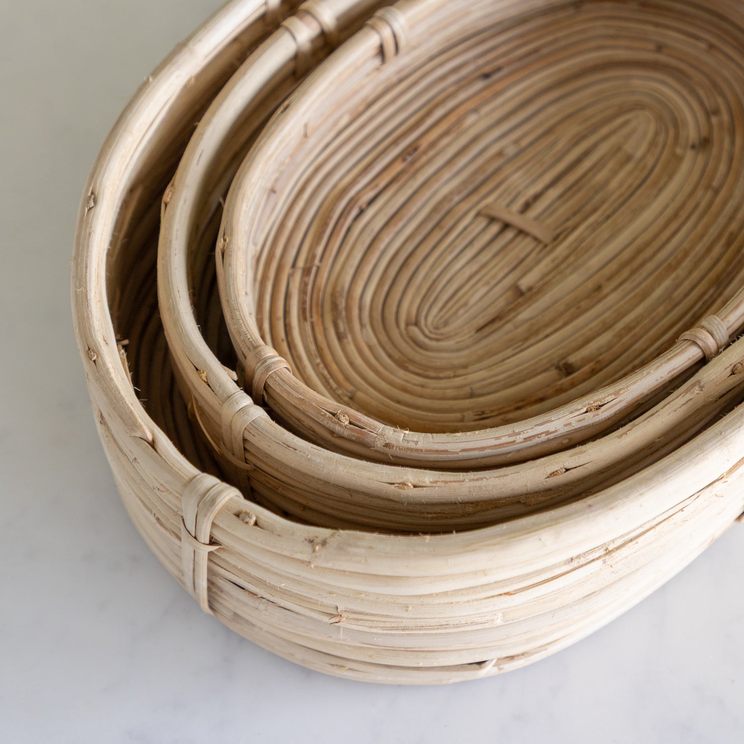 Stack of woven baskets on a light background