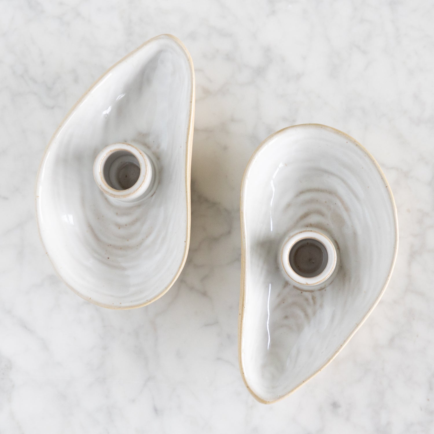 Two Oyster Shell candle holders. 