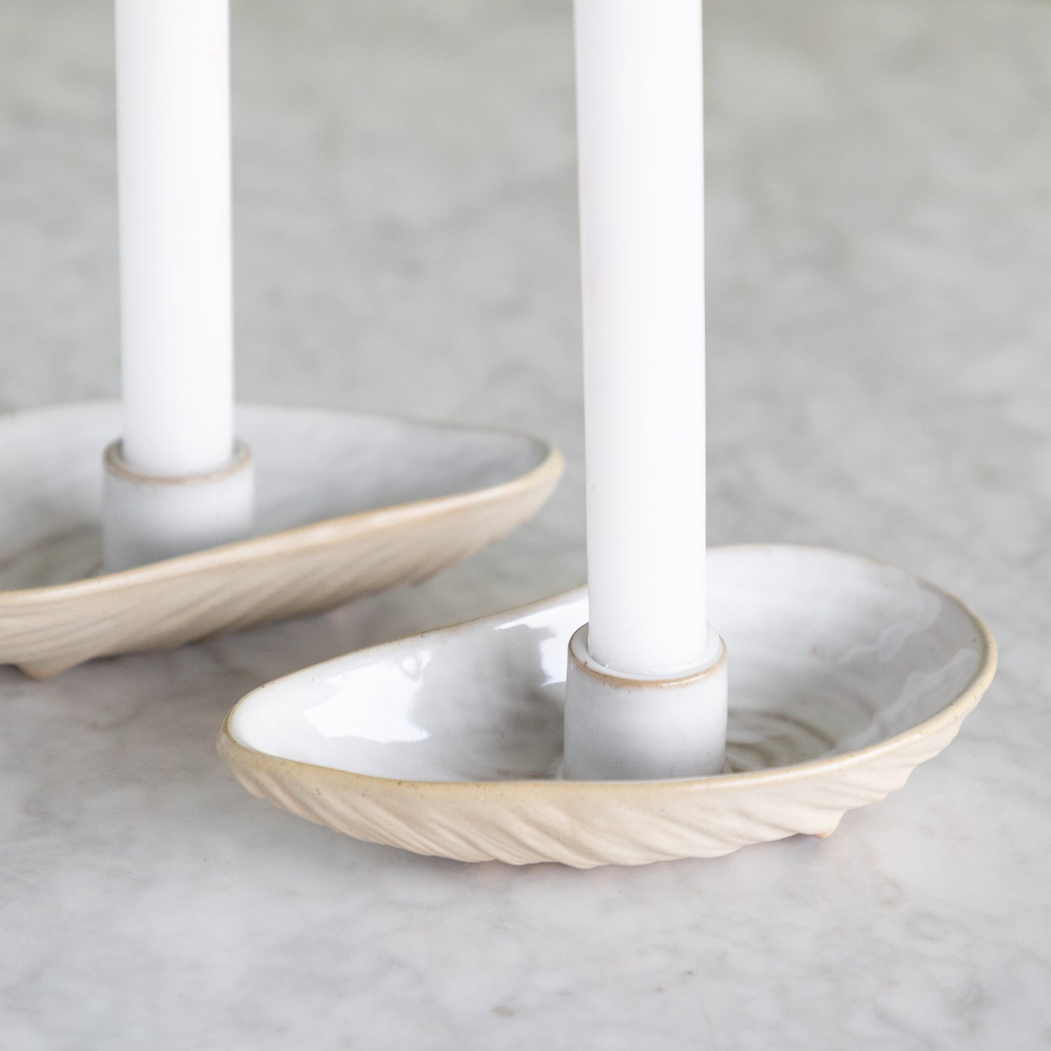 Close up of the oyster shell shaped taper candle holder. 