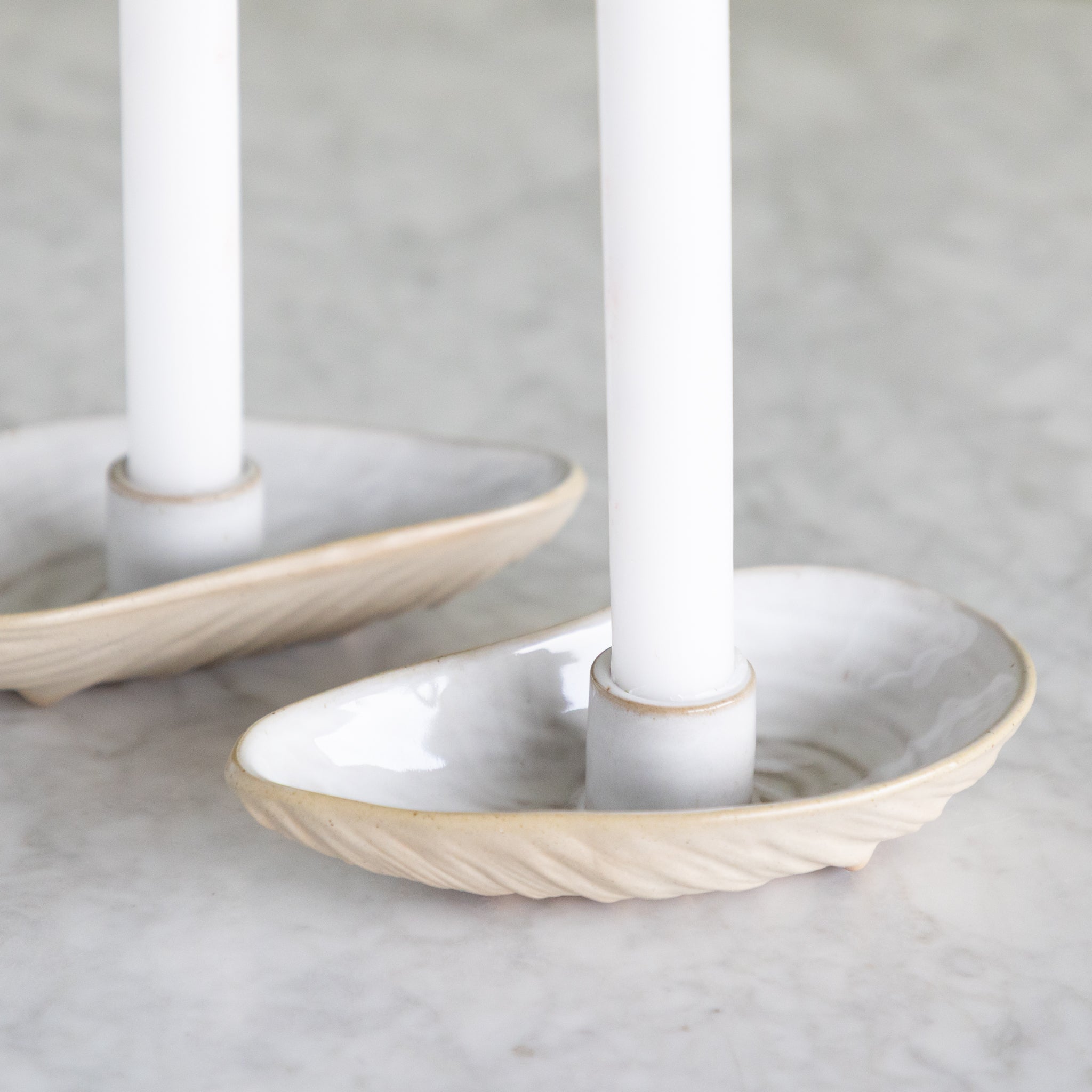 Close up of the oyster shell shaped taper candle holder. 