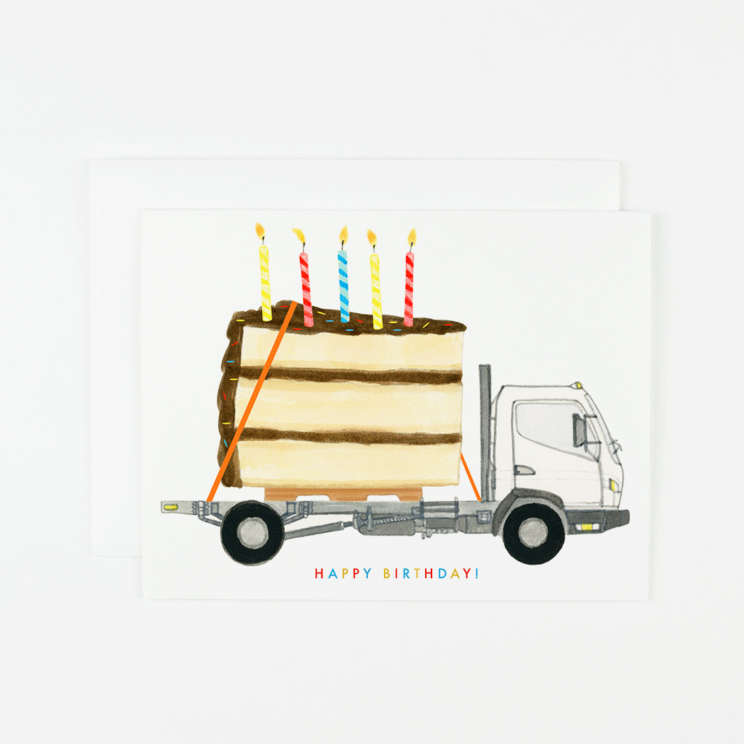 A Dear Hancock Big Happy Birthday Set of 6 card featuring an illustration of a truck carrying a large birthday cake with lit candles, printed in the United States.