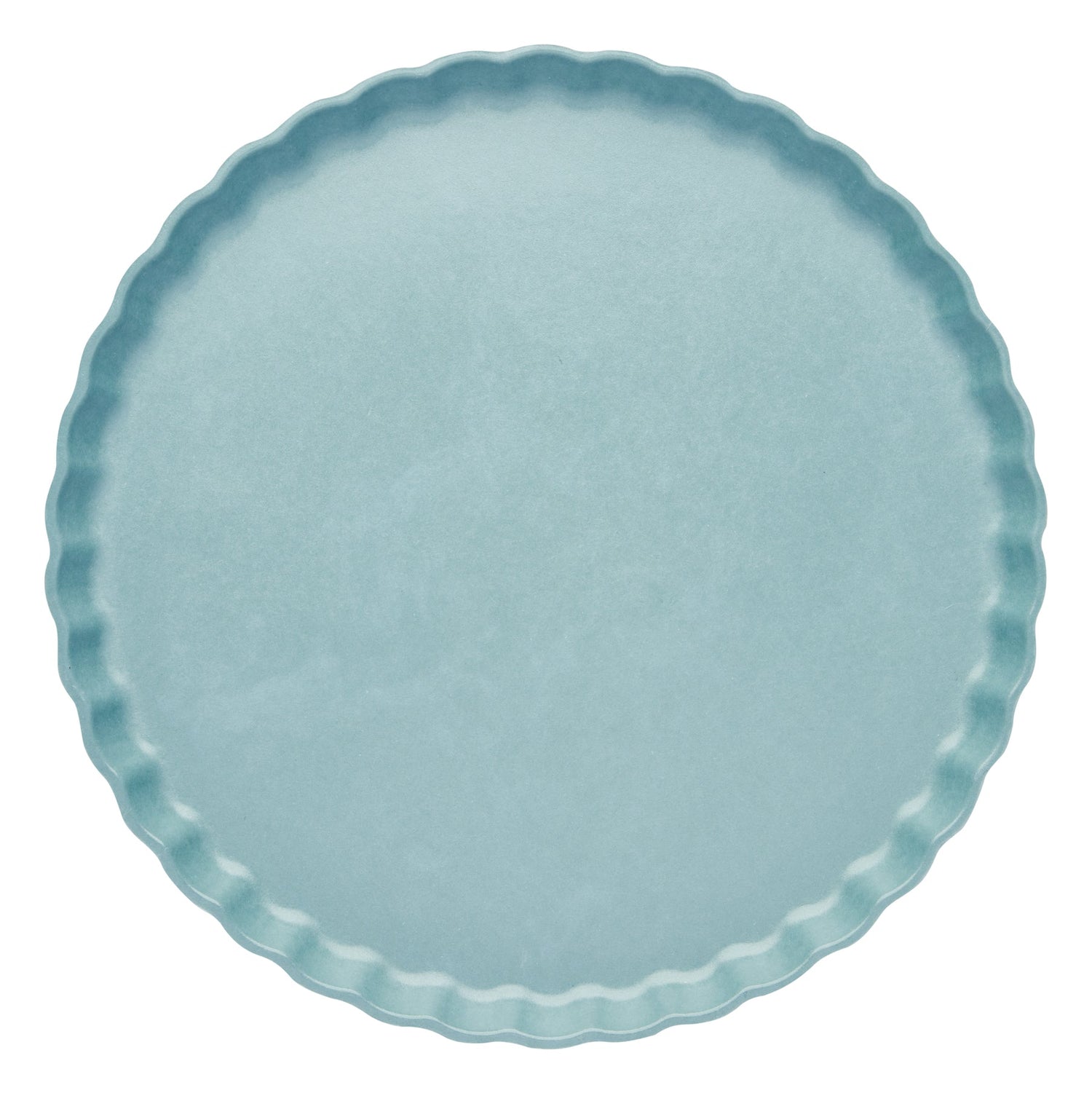 Light blue plate with scalloped edge on a white background
