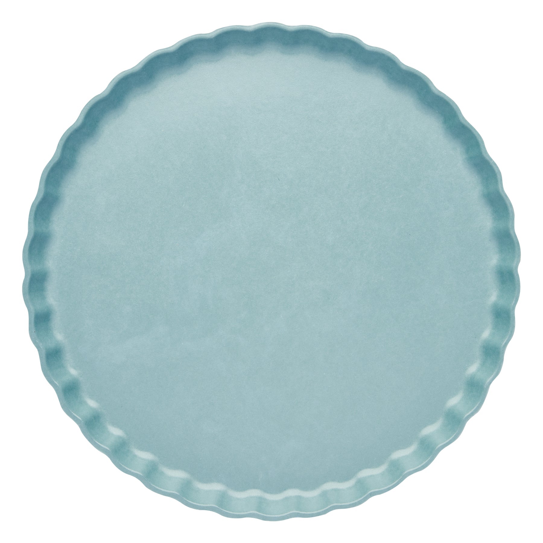 Light blue plate with scalloped edge on a white background