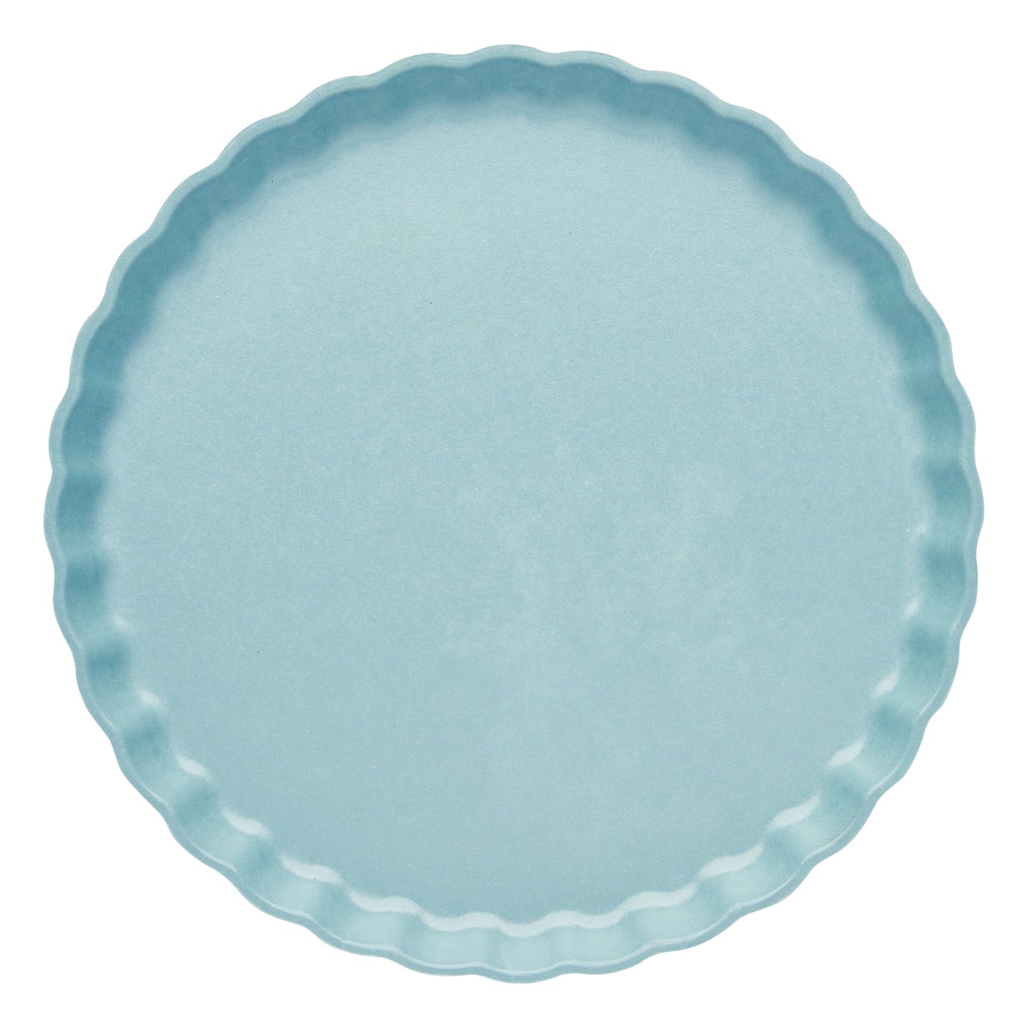 Light blue plate with scalloped edge on a white background