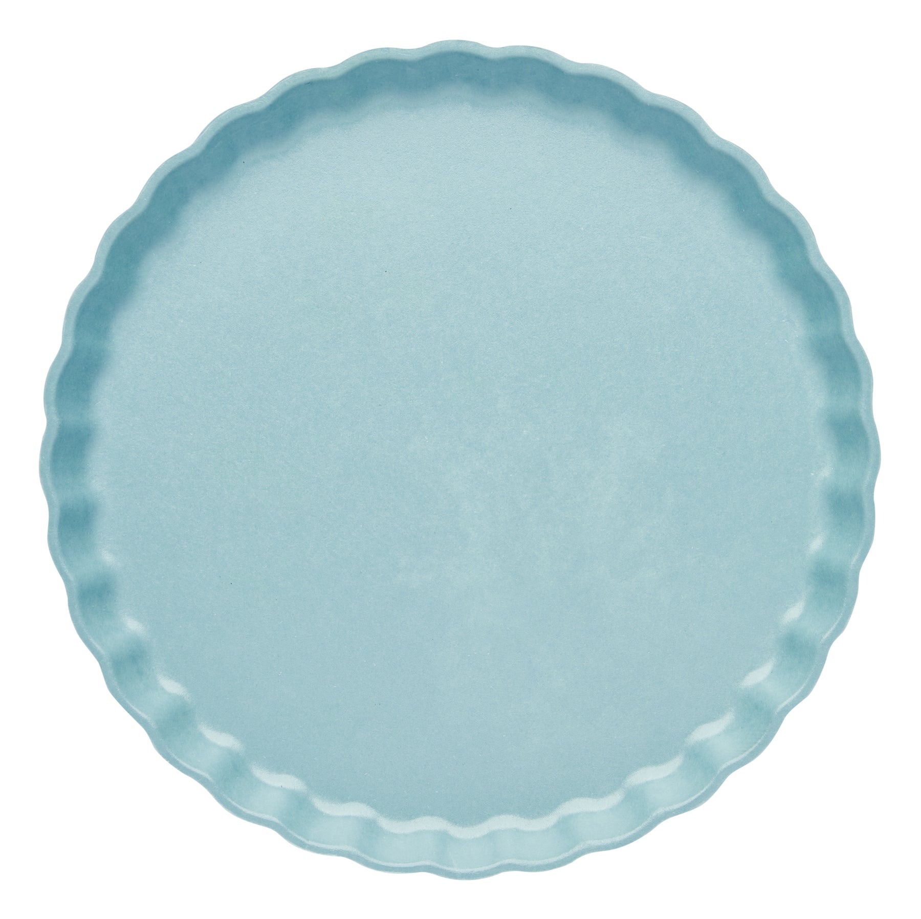 Light blue plate with scalloped edge on a white background