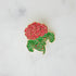 A red Geranium Enamel Pin adorned with a beautiful geranium flower from Hester & Cook.