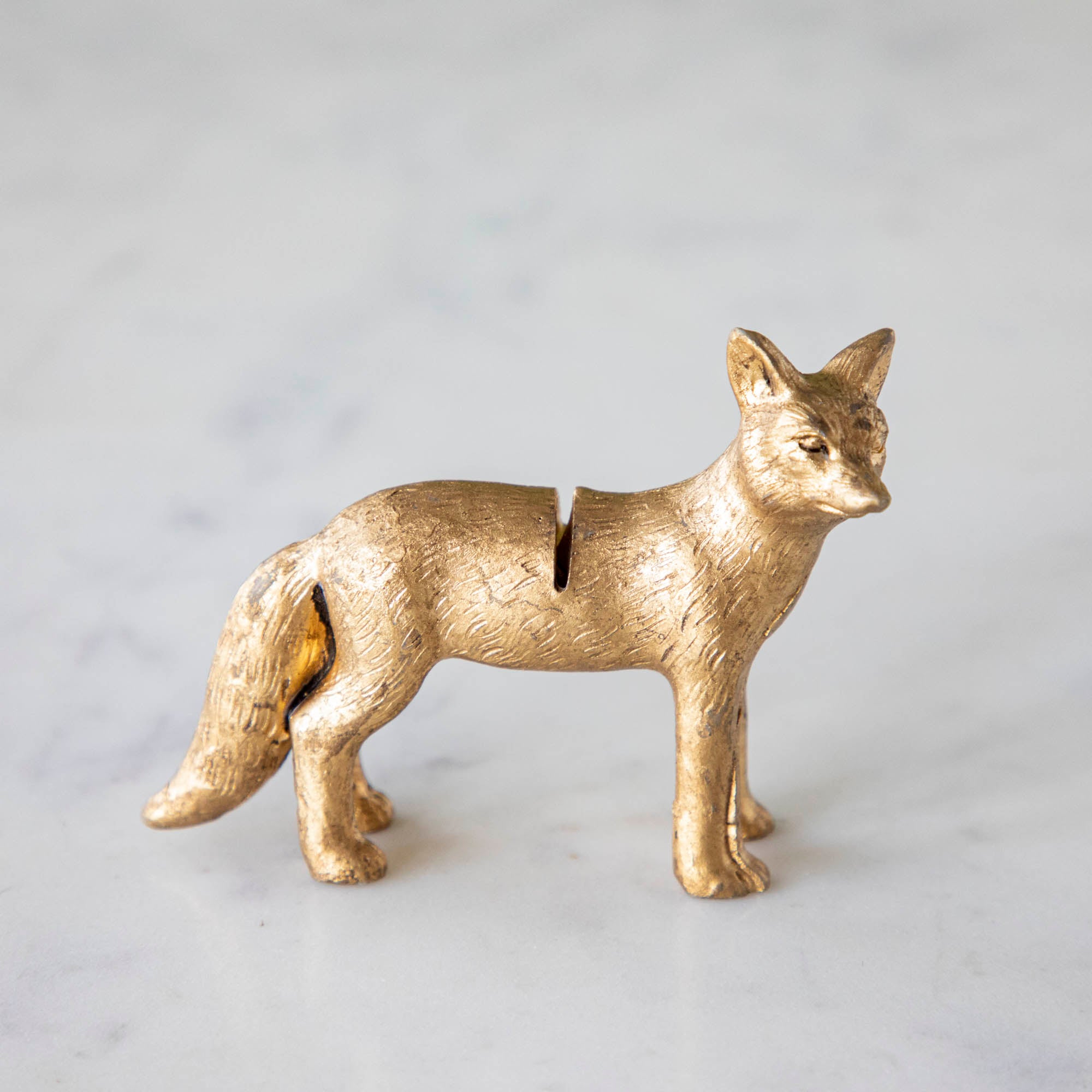 A side view of the Fox Name Card Holder showing the lined details and slot in its back.