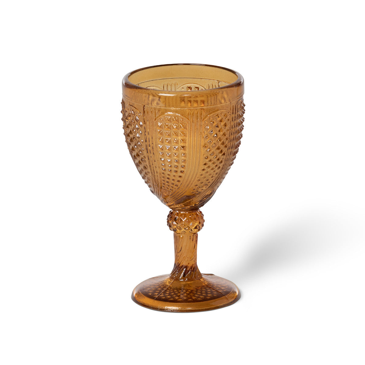 Vintage amber stemmed votive holder on a white background.