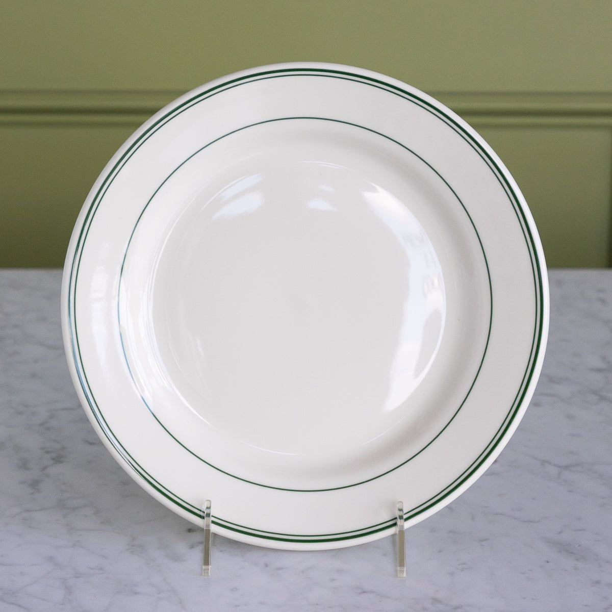 A white porcelain 9-inch appetizer plate with classic green stripes around the outer rim.