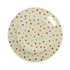 Round ceramic plate with multicolored polka dot pattern on a white background