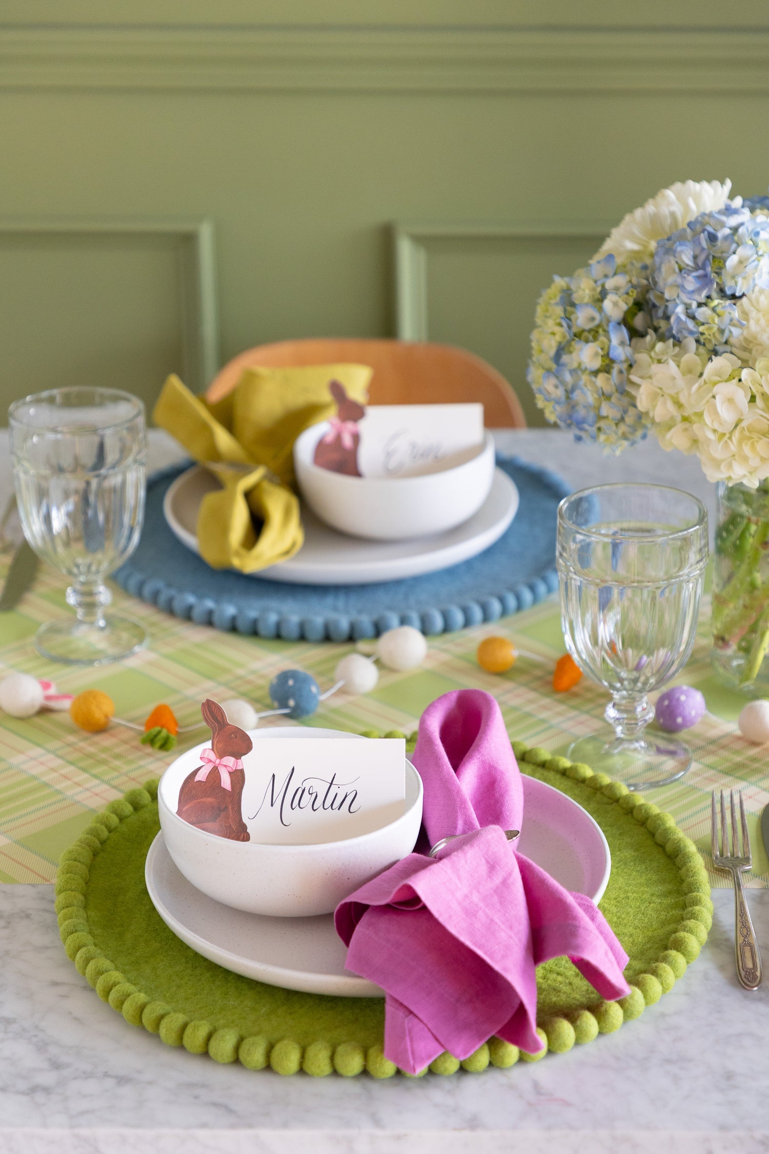 Easter-themed table setting with colorful decorations, Spring Green Pom Pom Felt Placemat, Hershey&
