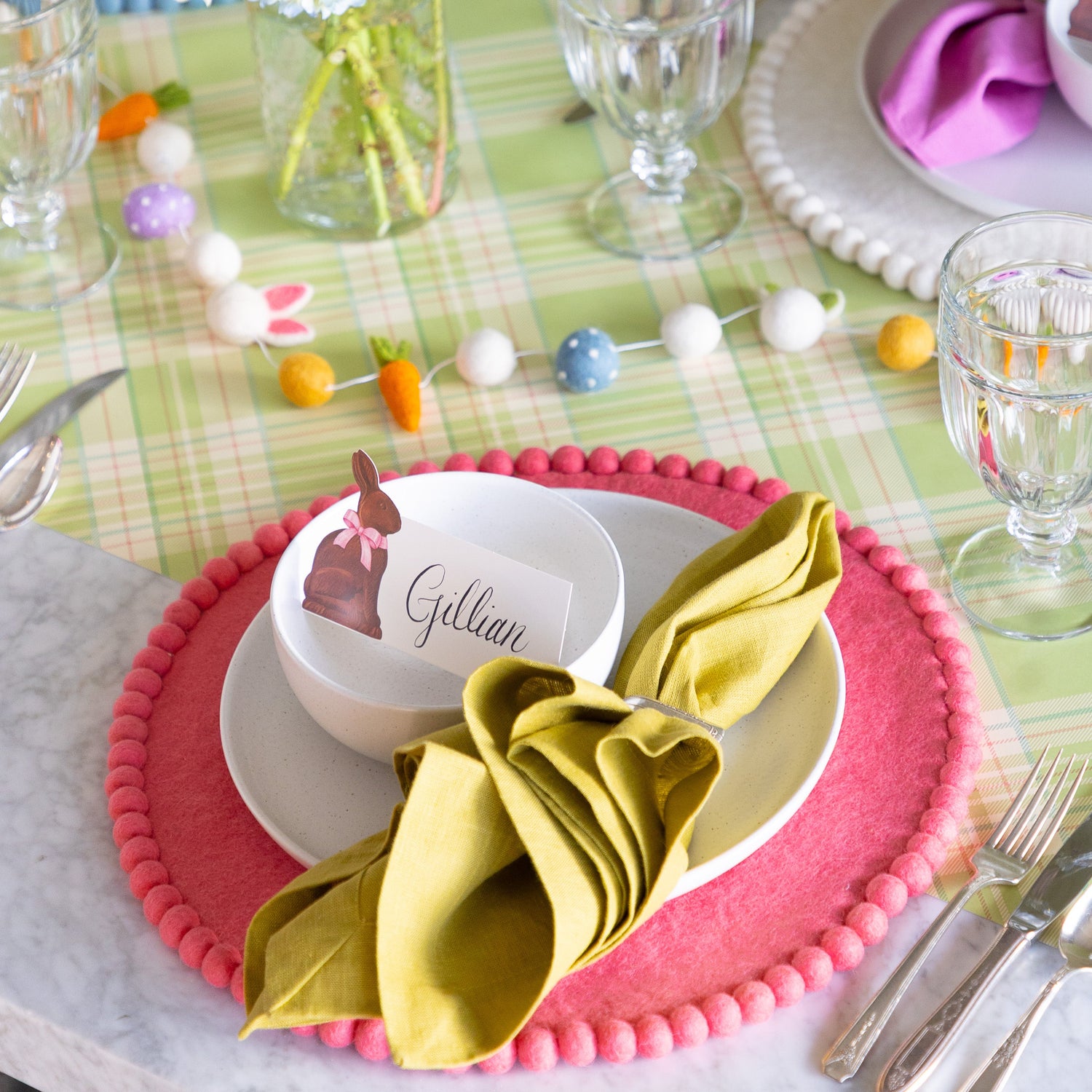 Easter place setting featuring the Pink Pom Felt Placemat, Hershey&