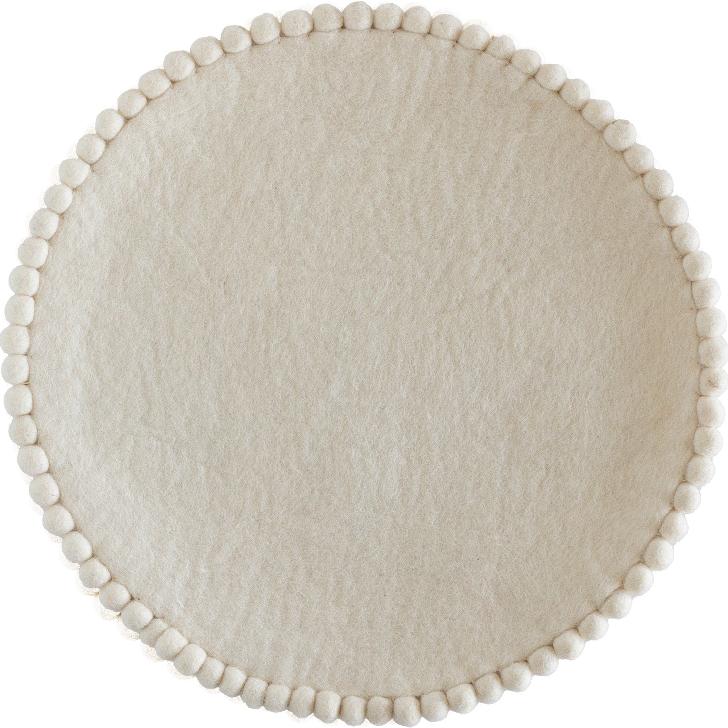 Ivory colored round felt placemat with small pom poms around the edge. 
