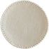 Ivory colored round felt placemat with small pom poms around the edge. 
