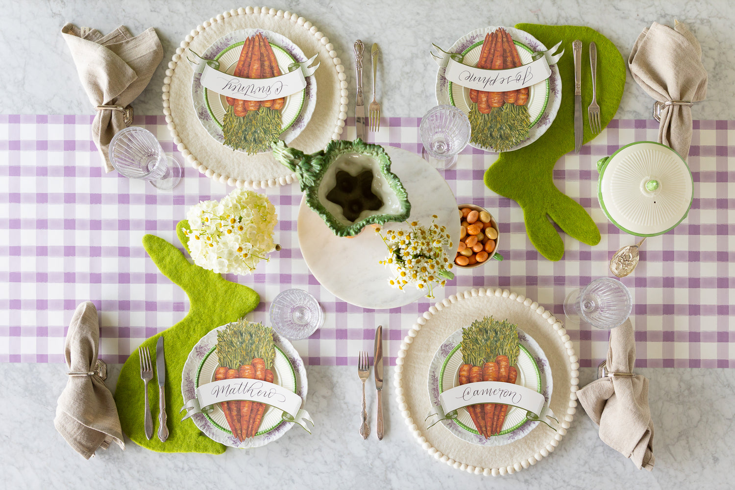 Easter-themed table setting with decorative plates, felt Spring Green Easter Bunny and Ivory Pom Pom Placemats, Carrots and Classic Moss Banner Table Accents.