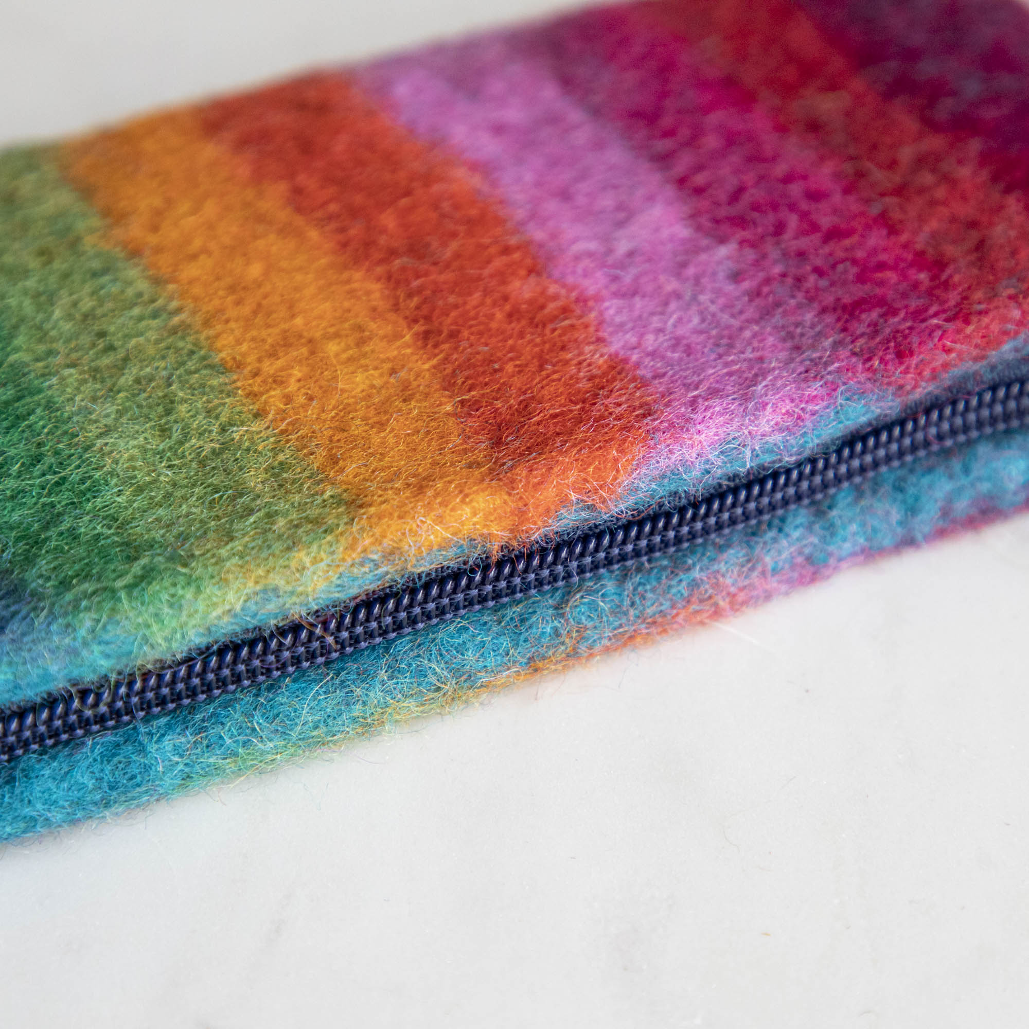 A close up of the Felt Rainbow Zipper pouch zipper.