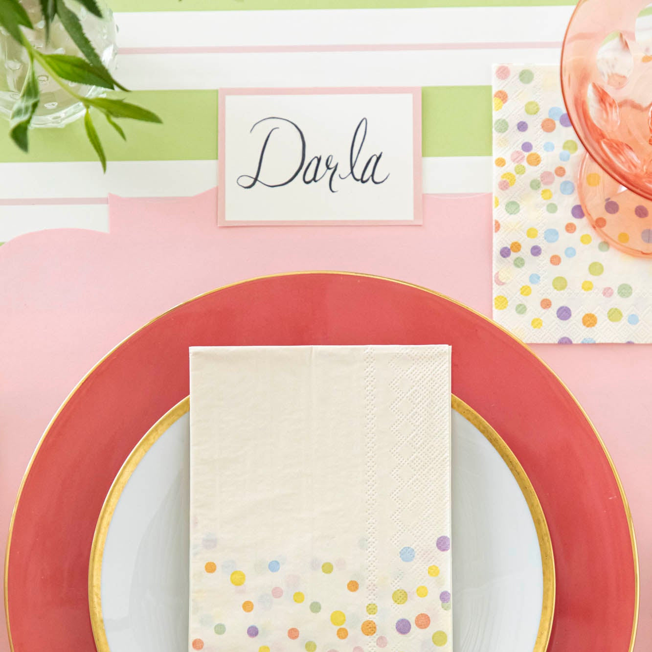 Pink Frame Place Card with &quot;Darla&quot; written on it, behind a place setting for one.